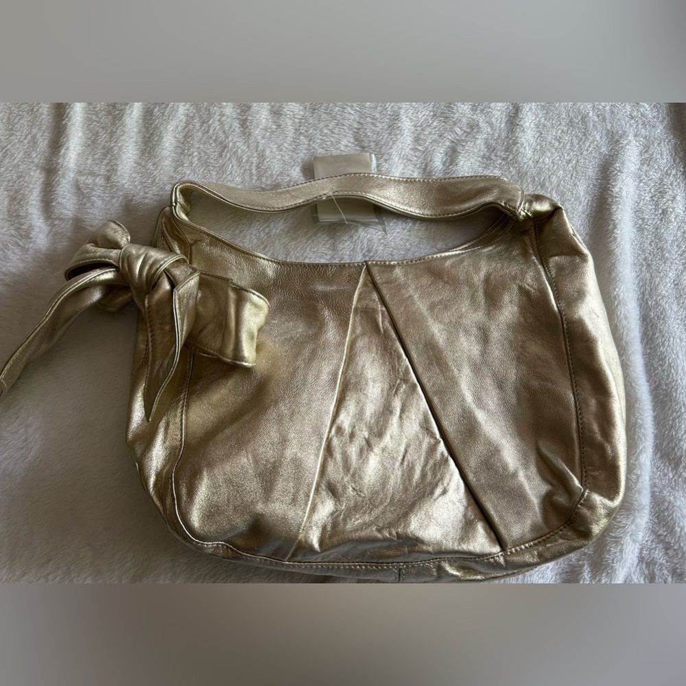 Bravo gold sheepskin Italian purse. NWT